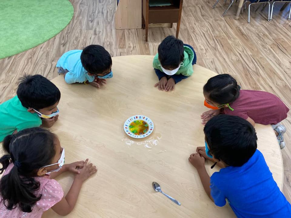 Kids sit at a round table at a Safari Kid franchise