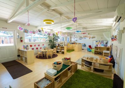 A large, Safari Kid classroom with multiple learning areas for the children and teachers.